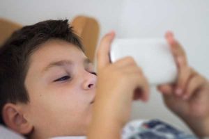 Boy using cell phone