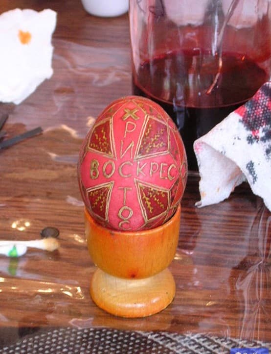 A red painted Easter hen's egg of Ukranian tradition.