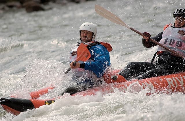Two men in a kayak competition on white water